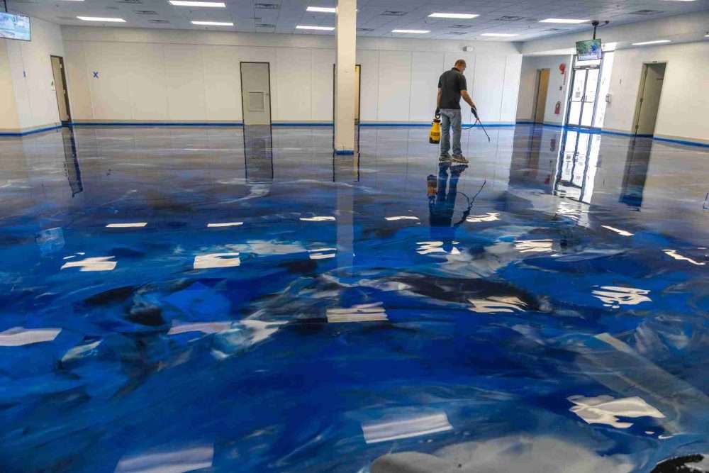 A large commercial flooring space with a metallic design epoxy resin installed.