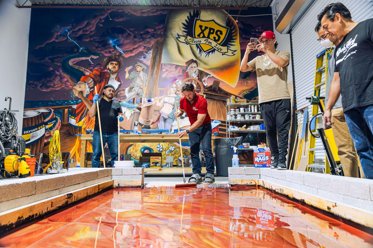 An epoxy class certification course with multiple students working on a resinous coating floor.