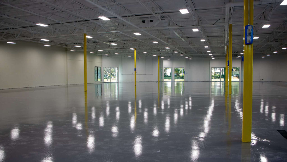 A large warehouse with a glossy epoxy floor installed.