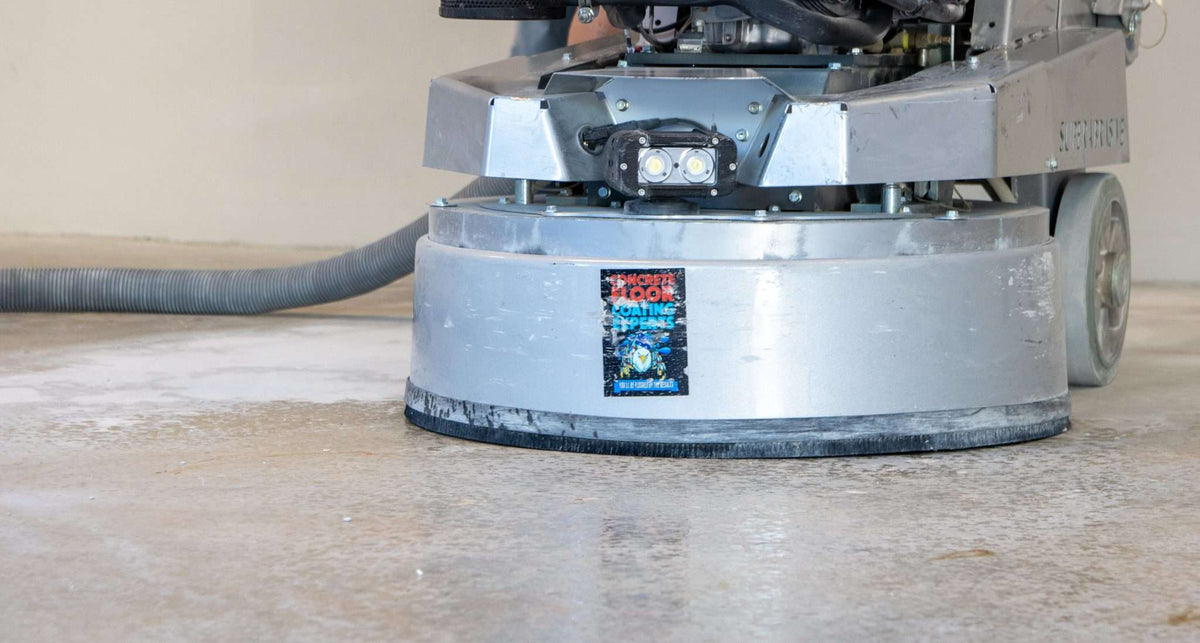 A concrete grinder with professional-grade diamond tools installed.