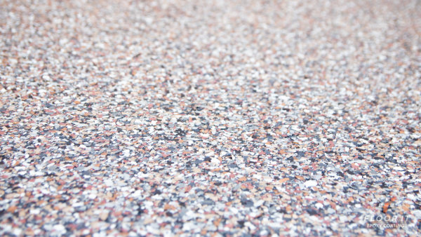 An epoxy flake floor made with vinyl flakes in multiple colors.