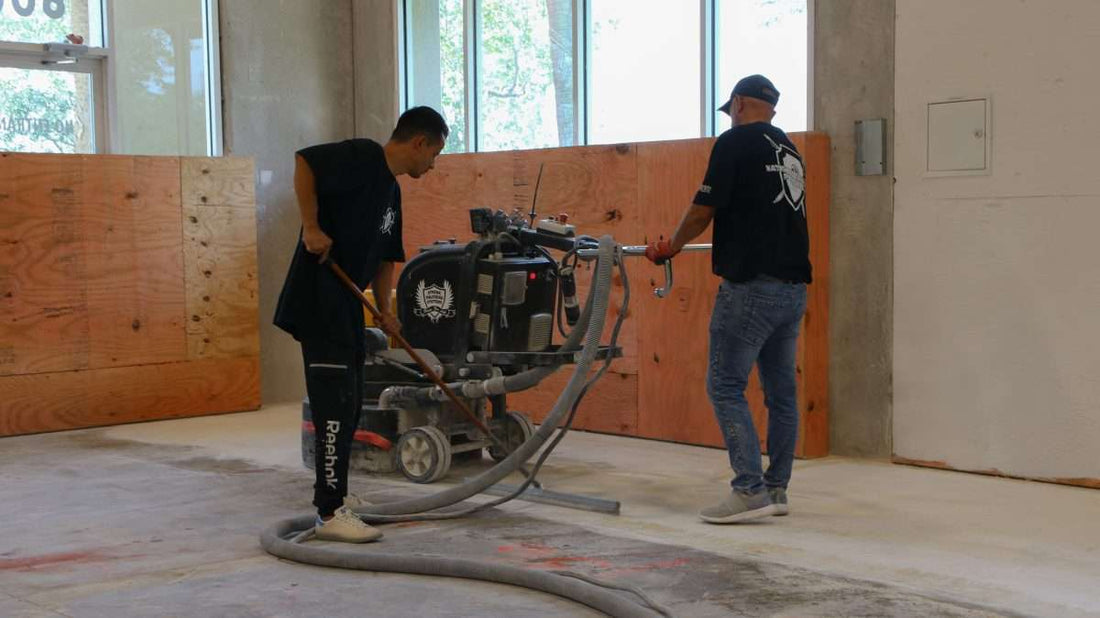 Mechanical surface prep work done by professional flooring contractors with a large floor grinder.