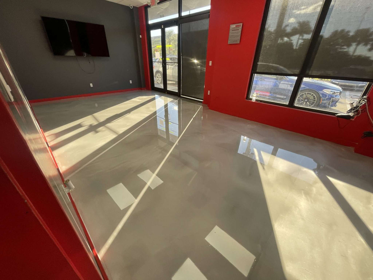 Epoxy flooring system installed in a commercial entryway with a marble design.