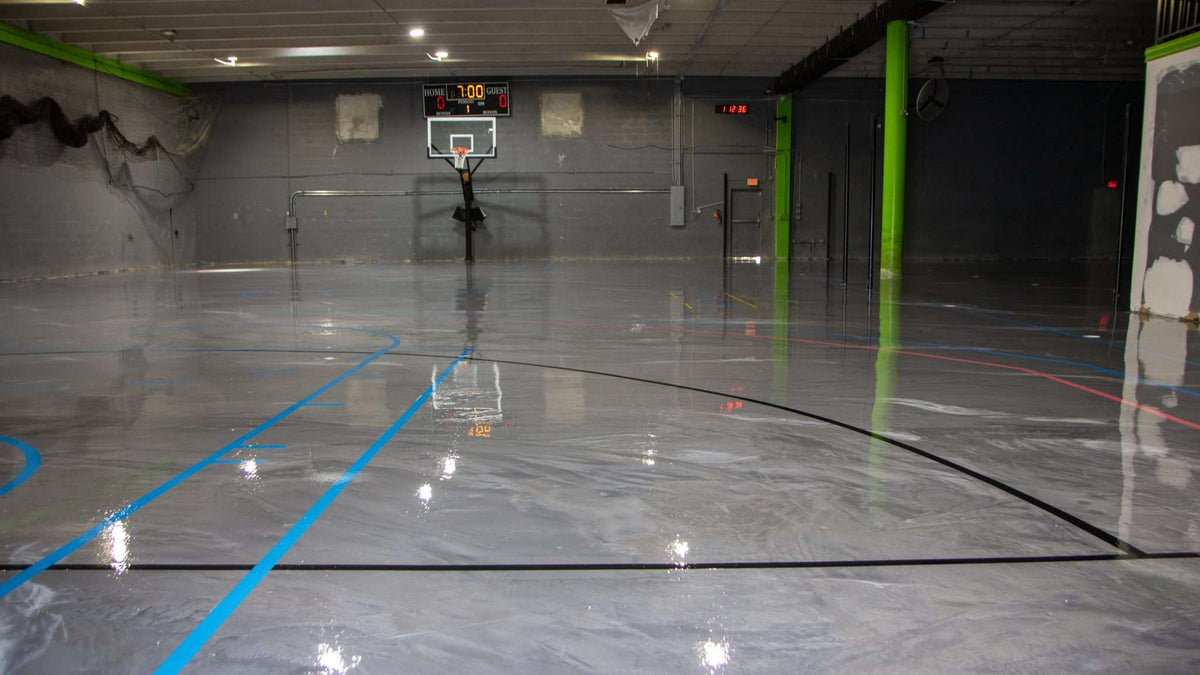 A large industrial warehouse flooring space with an epoxy resin system installed in it.