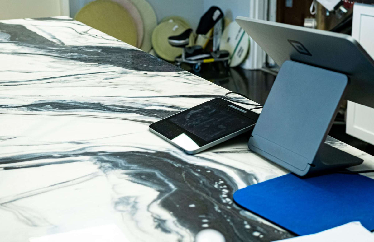 Epoxy resin countertop in a commercial space with a metallic/stone epoxy resin design.
